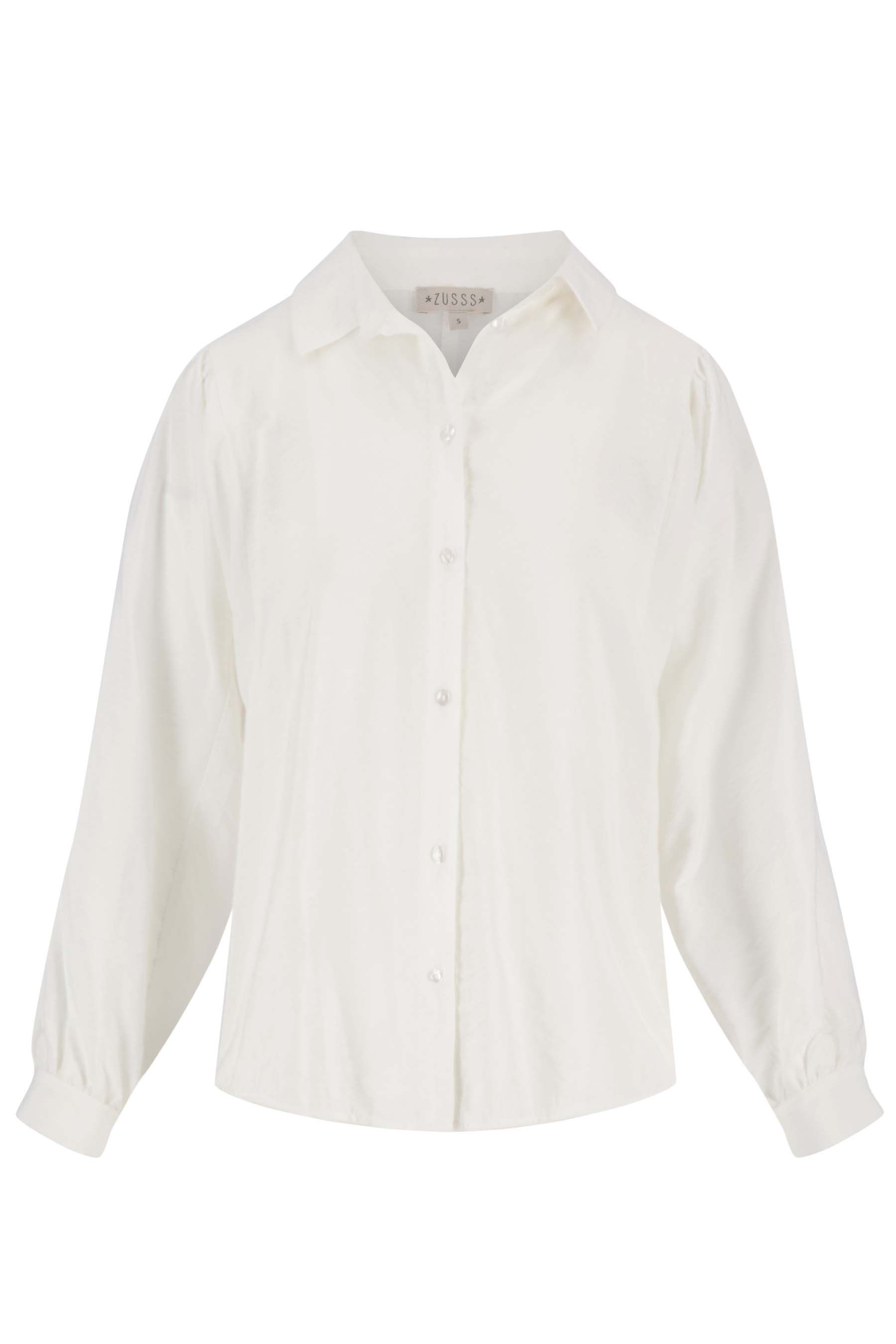 Witte blouse best sale met trui erover